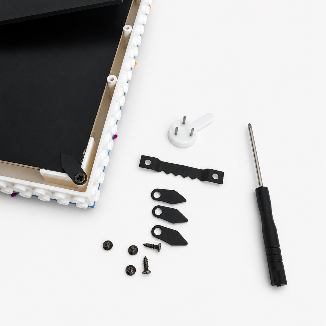 A disassembled electronic device or panel with a black front cover, white frame, mounting brackets, screws, and a screwdriver on a clean white background.